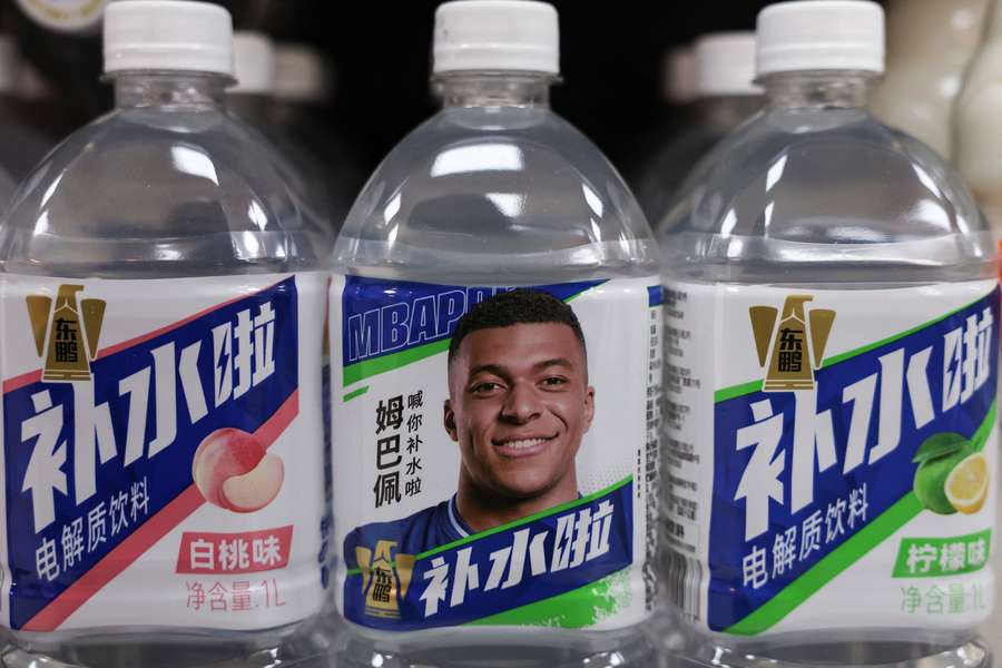 Bottled drinks with images of Kylian Mbappe are displayed in China Bottled drinks with images of Kylian Mbappe are displayed in China