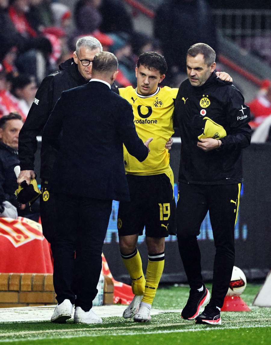 Konstantinos Karetsas as he is helped after sustaining an injury